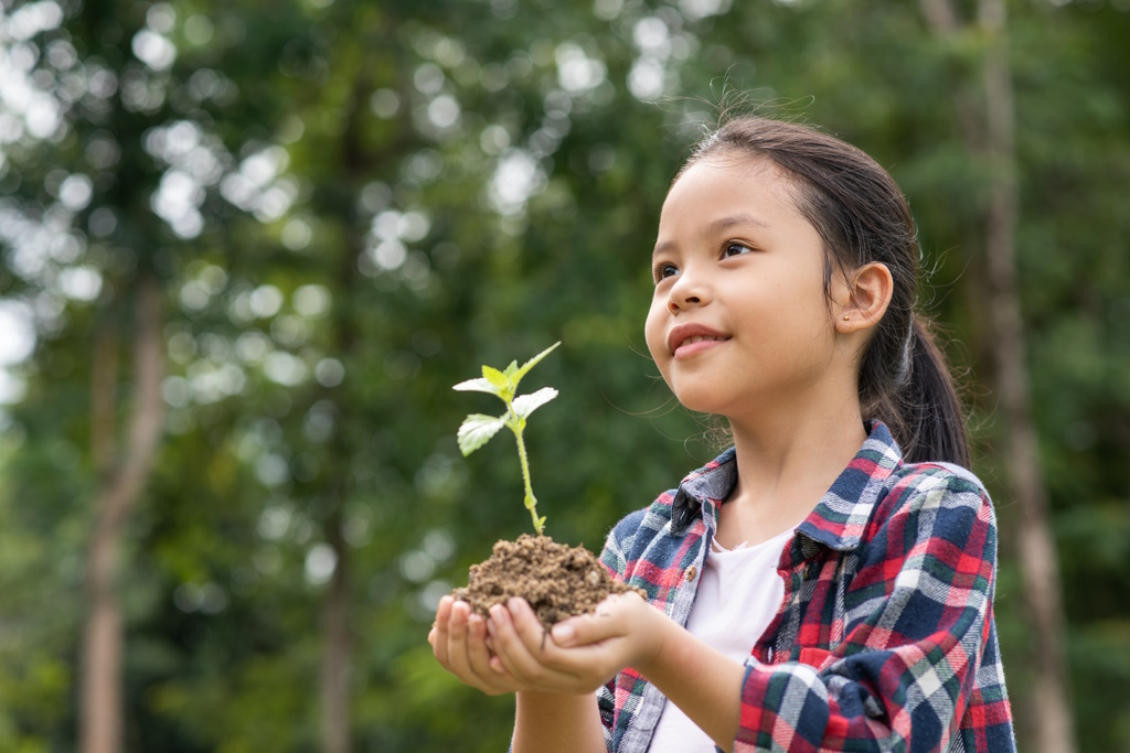 Asian girl holding plant soil 1024